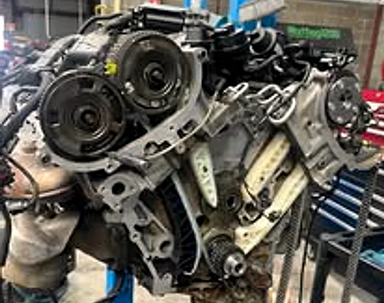 An engine out of the car for a full rebuild at Atelier Automotive